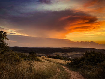 Scenic view of landscape against sky during sunset