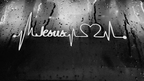 Close-up of text on wet wall