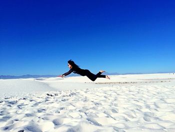 Full length of a person on snow covered landscape