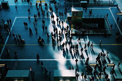 High angle view of people walking in city