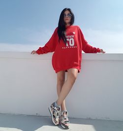 Portrait of beautiful woman against sky