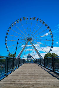 Ferris wheel against blue sky