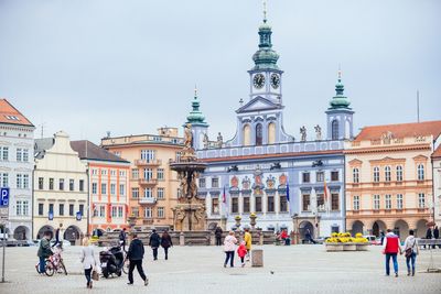 Group of people in front of buildings