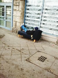 Low section of man sitting on floor