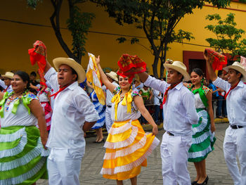 Group of people in traditional clothing during festival