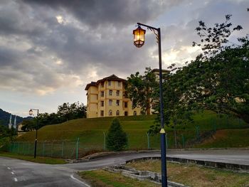 Street light by road against sky