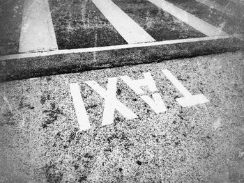 High angle view of arrow sign on road