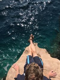 Low section of men relaxing in water