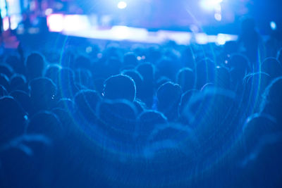 Crowd of people partying during live rock concert 