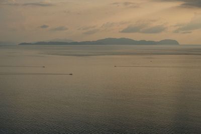 Scenic view of beach against sky during sunset