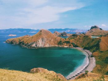 Panoramic view of sea and mountains against sky