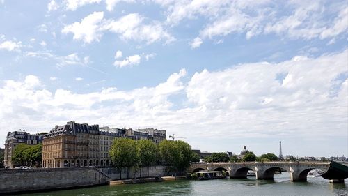 Low angle view of bridge over river against sky