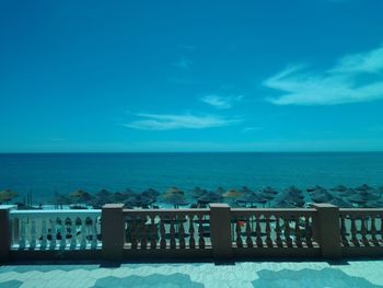 Scenic view of sea against blue sky