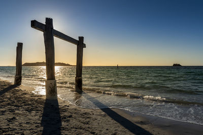 Scenic view of sea against clear sky during sunset