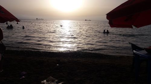 Scenic view of calm sea at sunset