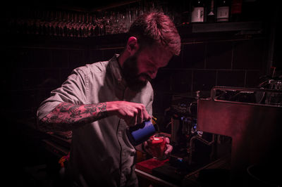 Side view of man playing