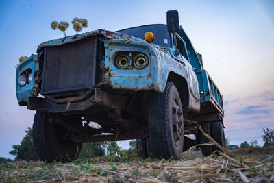 Old truck parked in rice fields in thailand.