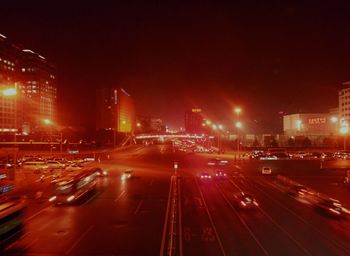 High angle view of illuminated city street at night