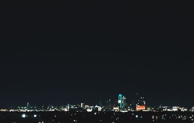 Illuminated cityscape at night