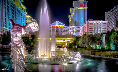 Illuminated fountain at night