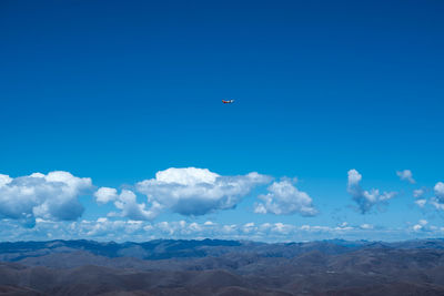 Low angle view of airplane flying in sky