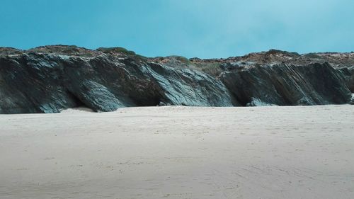 Scenic view of beach against clear sky