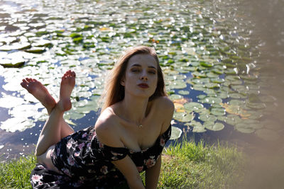 Portrait of young woman in water