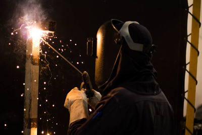 Man working on metal in workshop