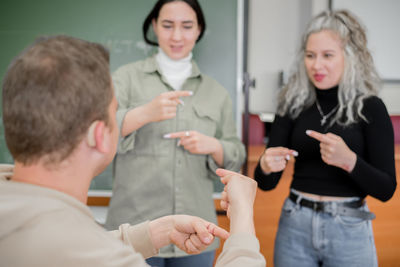 Business colleagues stacking hands