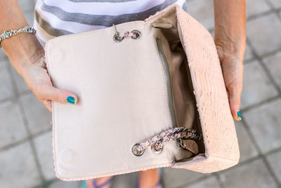 Girl holding a bag made of handmade python skin