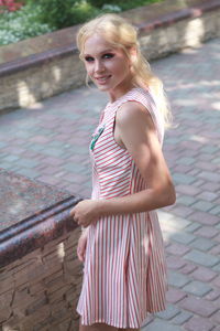 Portrait of woman wearing striped top