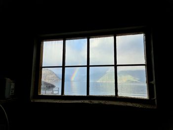 Sea seen through window of house