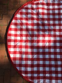 Close up of red pattern on tiled floor