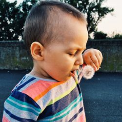 Close-up of cute girl looking away