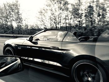 Close-up of car on road
