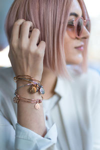 Close-up of young woman wearing sunglasses