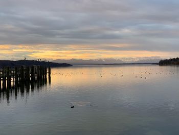 Scenic view of lake against sky during sunset
