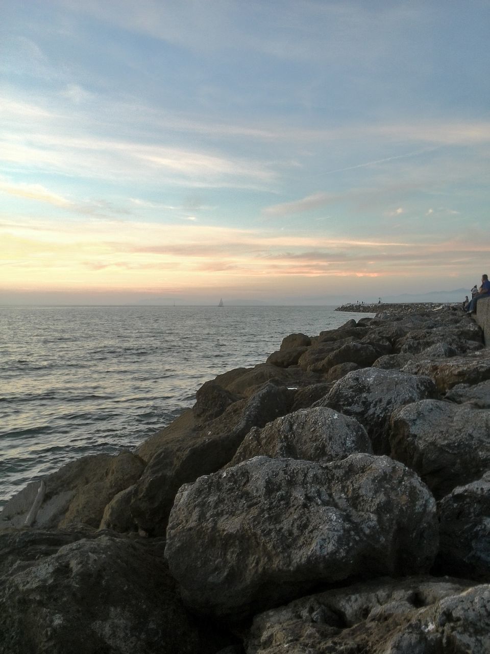 sea, horizon over water, sky, water, rock - object, scenics, beach, beauty in nature, tranquil scene, tranquility, sunset, shore, cloud - sky, nature, idyllic, lifestyles, rock formation, cloud