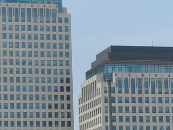 Low angle view of office building against sky