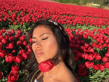 Beautiful woman with red flowers