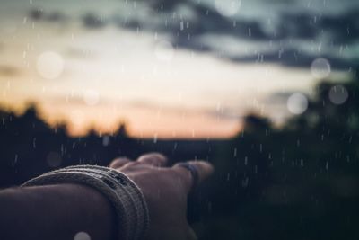 Close-up of hand against blurred background