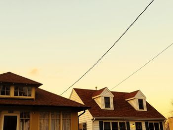 Low angle view of buildings against sky during sunset