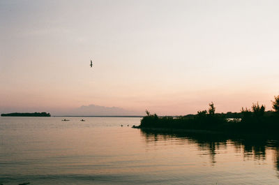 Scenic view of lake against sky during sunset