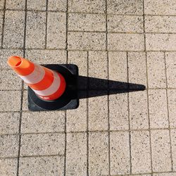 High angle view of traffic cone on footpath