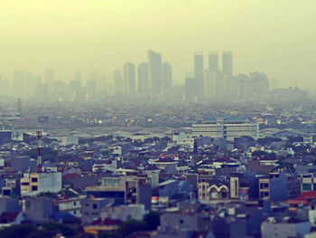 High angle view of buildings in city against sky