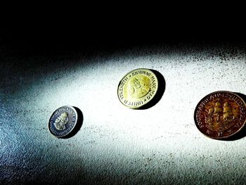 Close-up of coins on table