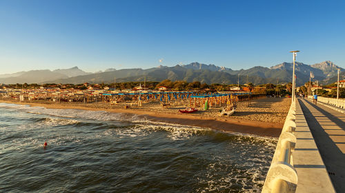 Panoramic shot of sea against clear blue sky