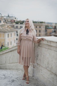 Full length of woman standing in city