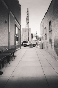 Street amidst buildings in city against sky