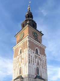 Low angle view of clock tower against sky